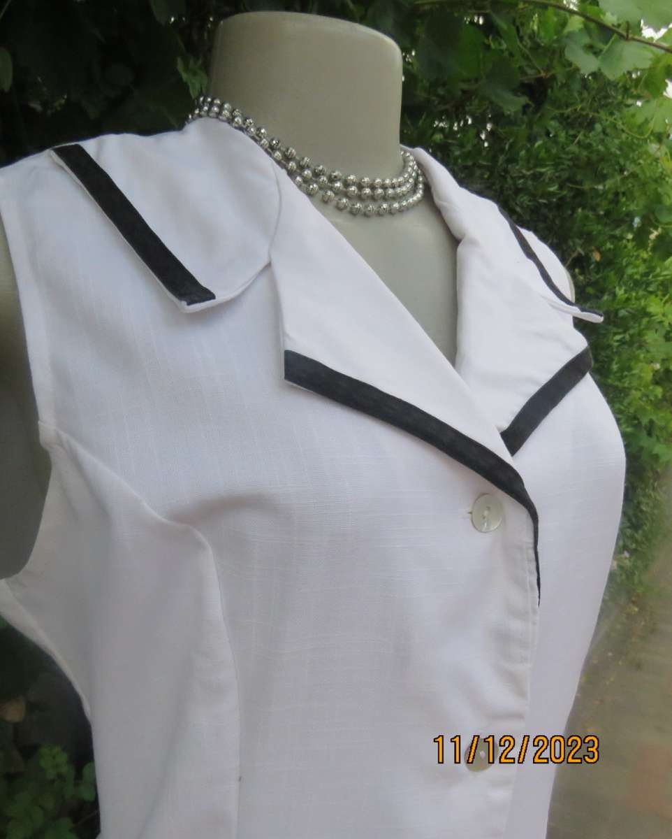 Winner for Summer! Sleek button down white ankle length dress. Size 36. Open collar/black edging.