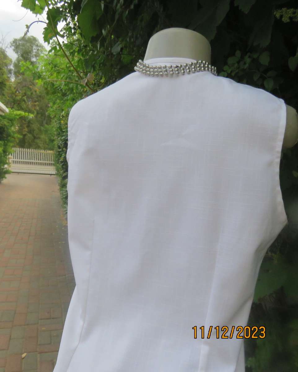 Winner for Summer! Sleek button down white ankle length dress. Size 36. Open collar/black edging.