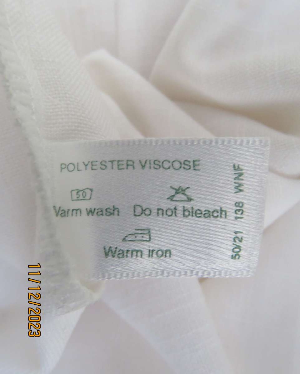 Winner for Summer! Sleek button down white ankle length dress. Size 36. Open collar/black edging.