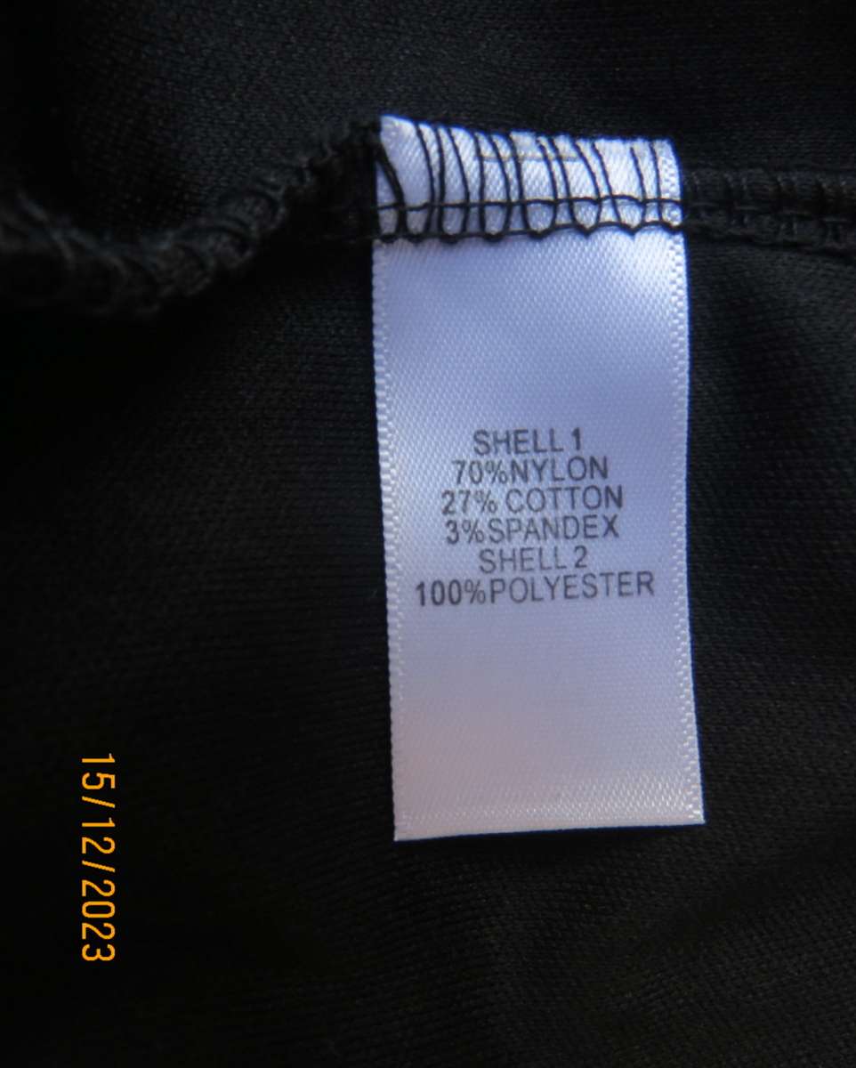 The little black poly/nylon lace dress. Lining stretch poly. Off shoulder/frilled neckline.Size 32