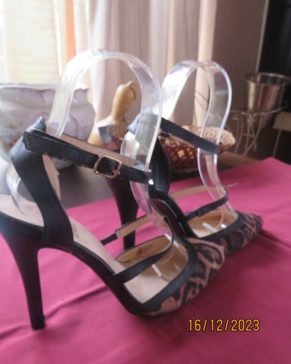 Pair of PUNK & IVY black and animal print high heel shoes. T strap. Size 5. Ankle strap.As new
