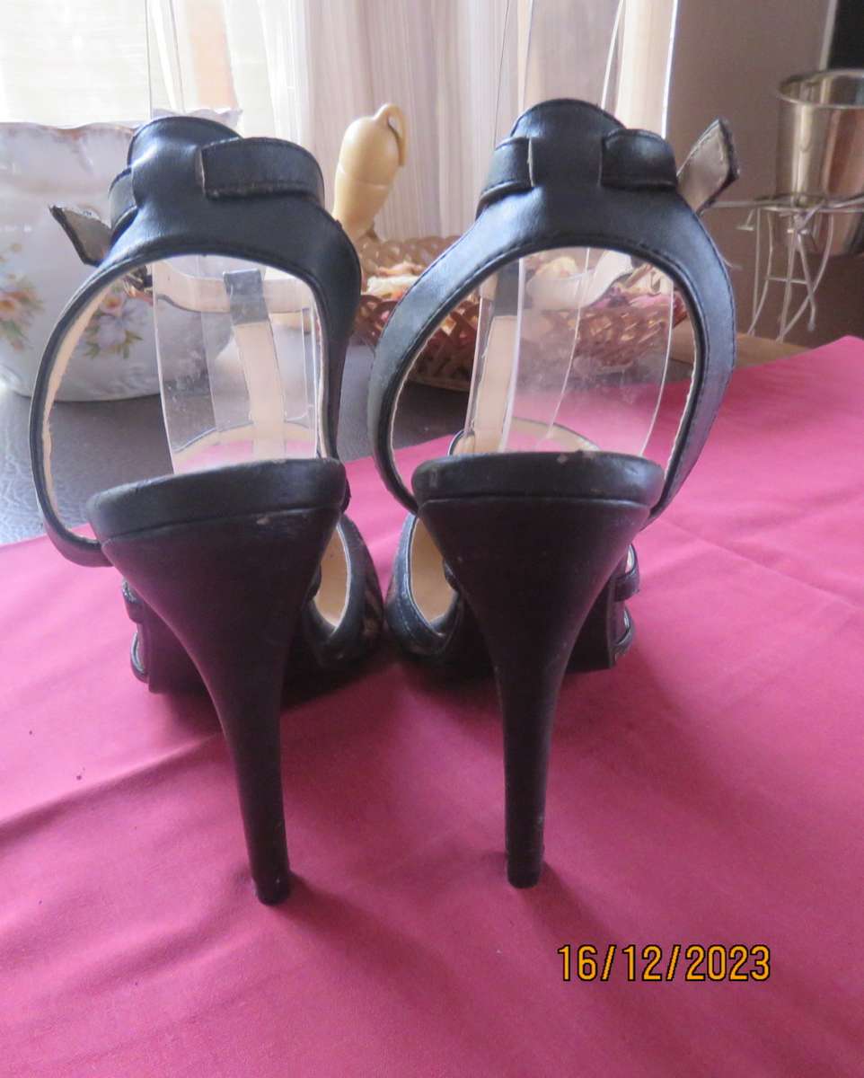 Pair of PUNK & IVY black and animal print high heel shoes. T strap. Size 5. Ankle strap.As new