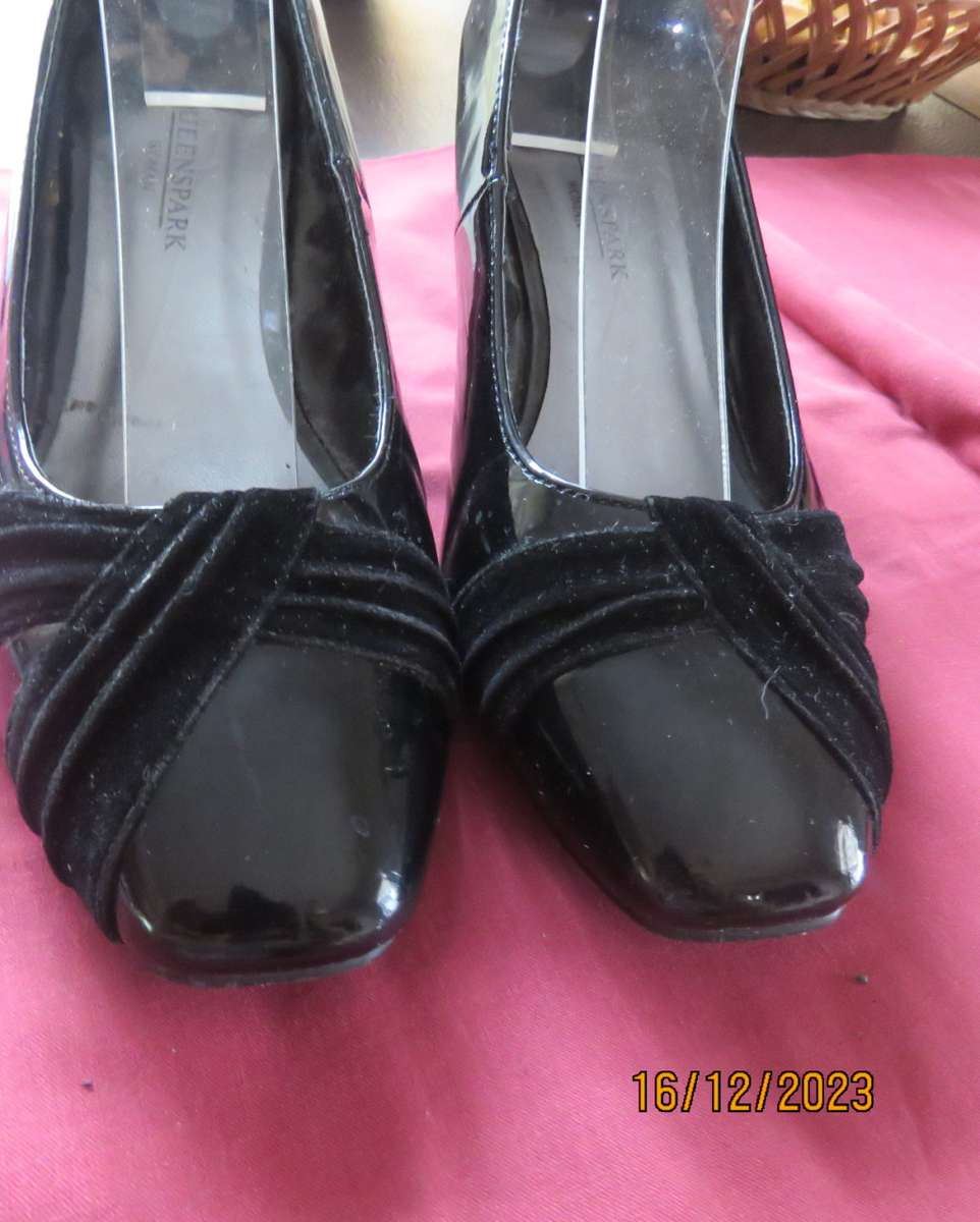 Pair of black shiny patent leather wedge heel shoes by QUEENSPARK size 5. Velvet crossovers.As new