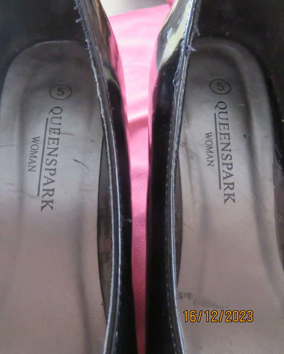 Pair of black shiny patent leather wedge heel shoes by QUEENSPARK size 5. Velvet crossovers.As new