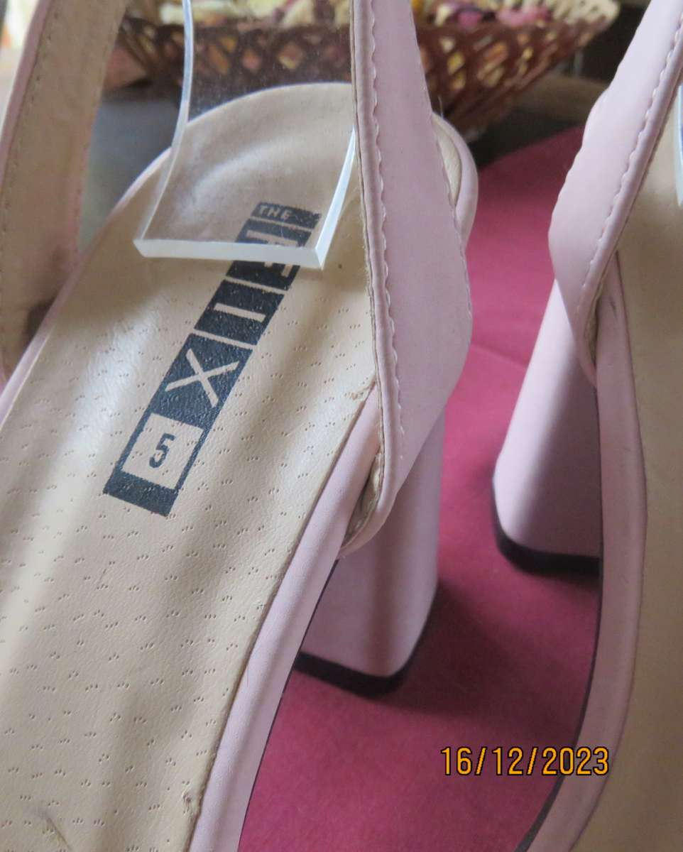 Pair of pale pink block heel sandals with ankle straps. Band over foot with faux fur.Size 5 by FIX.