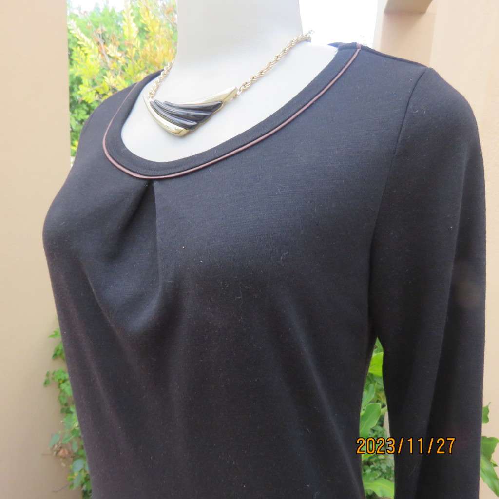 Elegant black jersey shift dress with black/brown striped bottom. Long sleeves. Size 34 from Korea.
