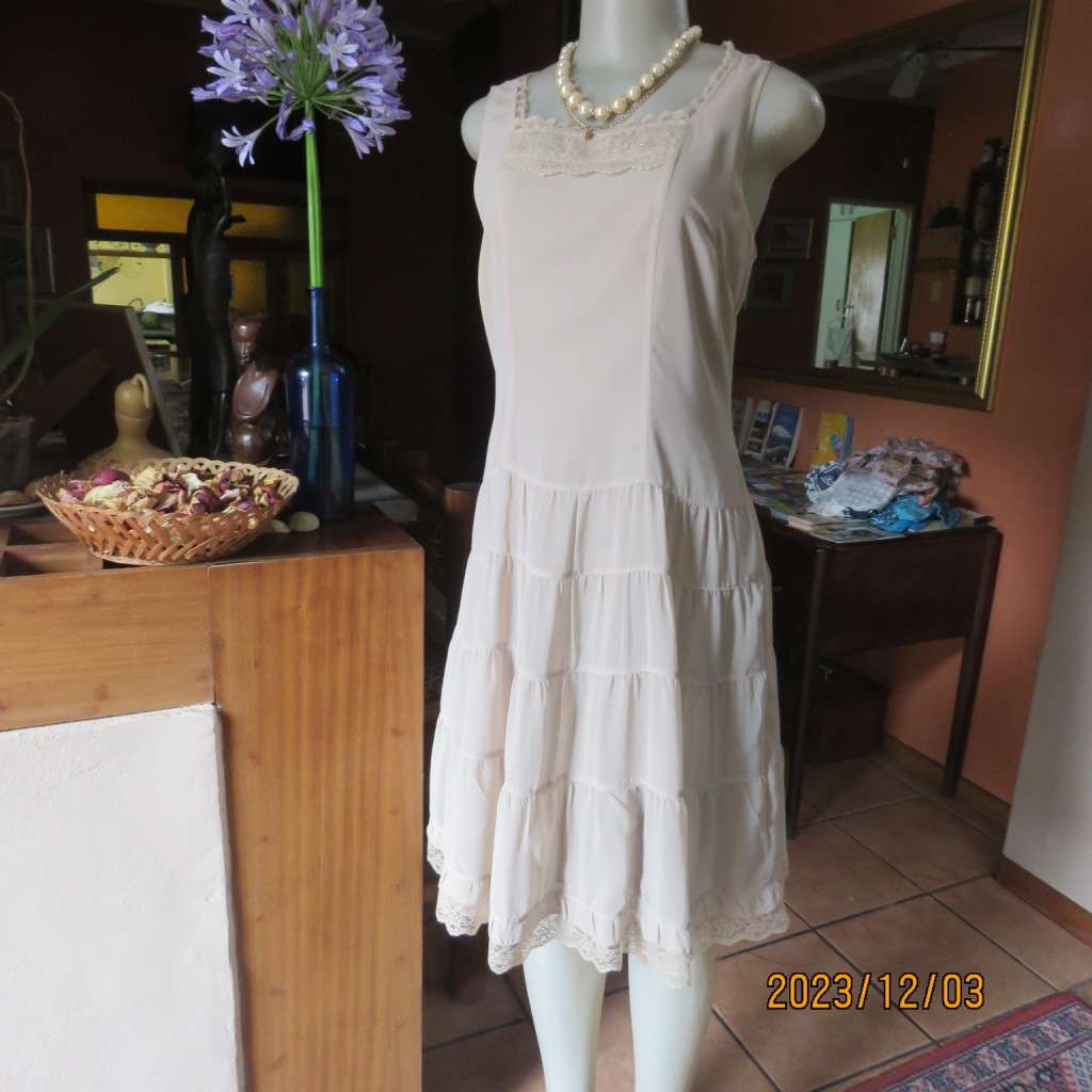 Smart ecru colour dropped waist dress with tiered bottom. Size 36. Square neckline. Fully lined.