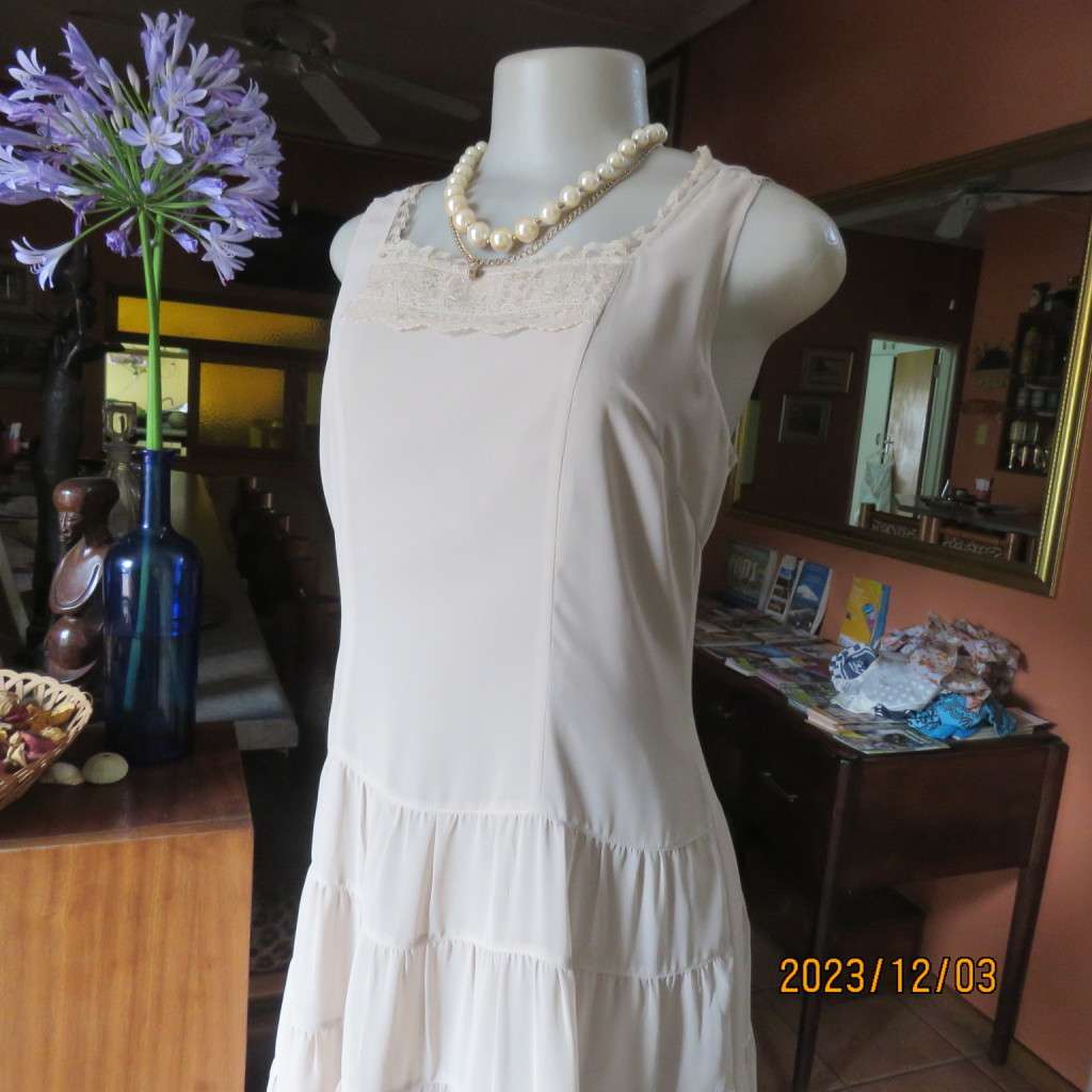 Smart ecru colour dropped waist dress with tiered bottom. Size 36. Square neckline. Fully lined.