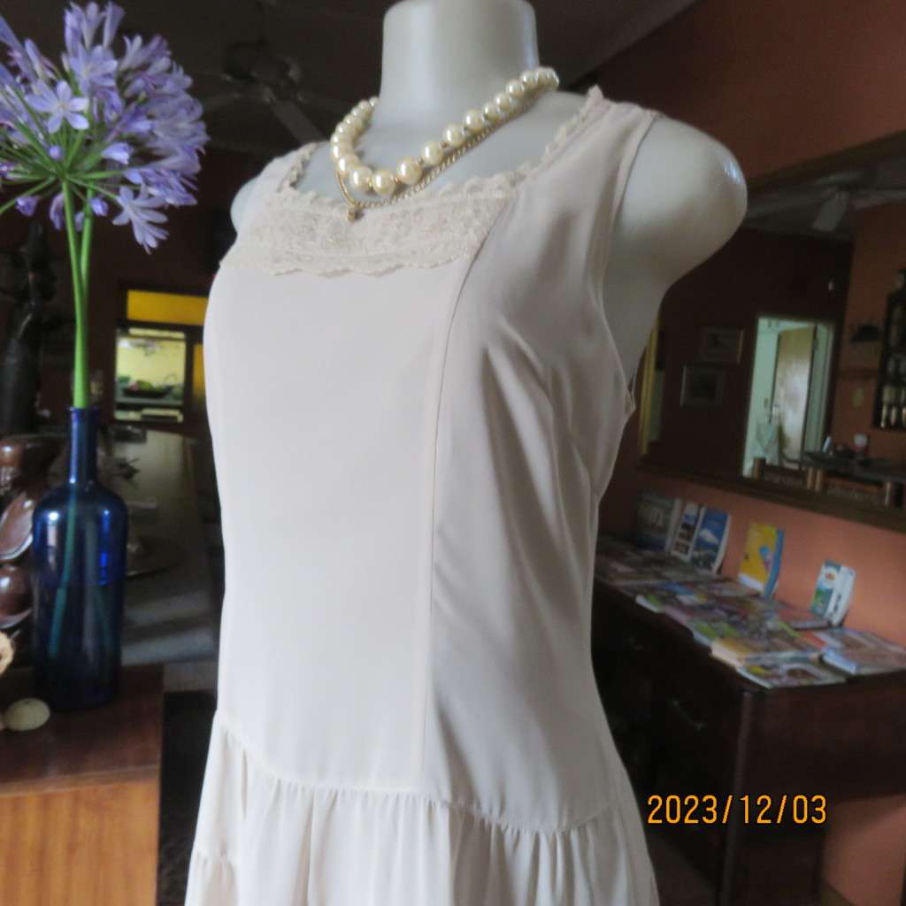 Smart ecru colour dropped waist dress with tiered bottom. Size 36. Square neckline. Fully lined.