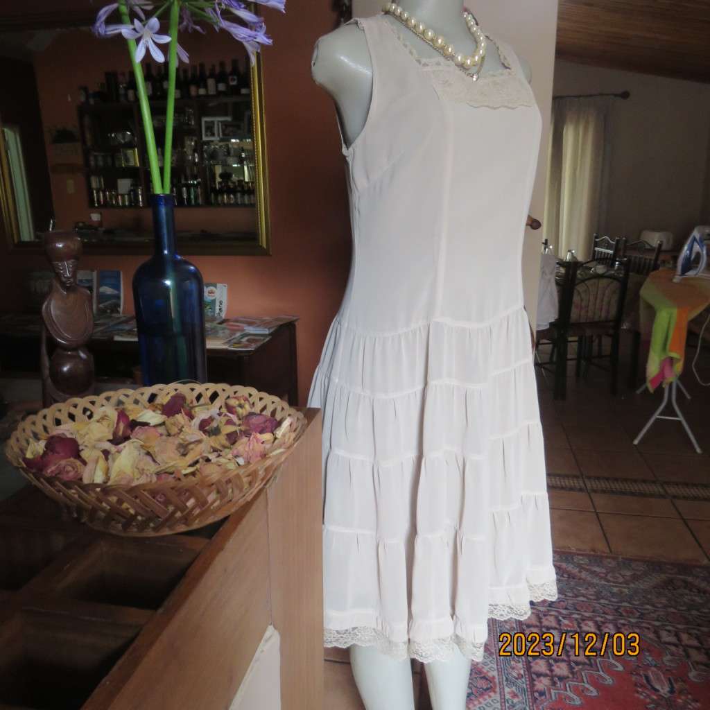 Smart ecru colour dropped waist dress with tiered bottom. Size 36. Square neckline. Fully lined.