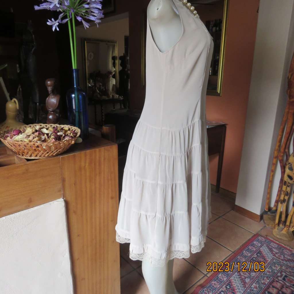 Smart ecru colour dropped waist dress with tiered bottom. Size 36. Square neckline. Fully lined.