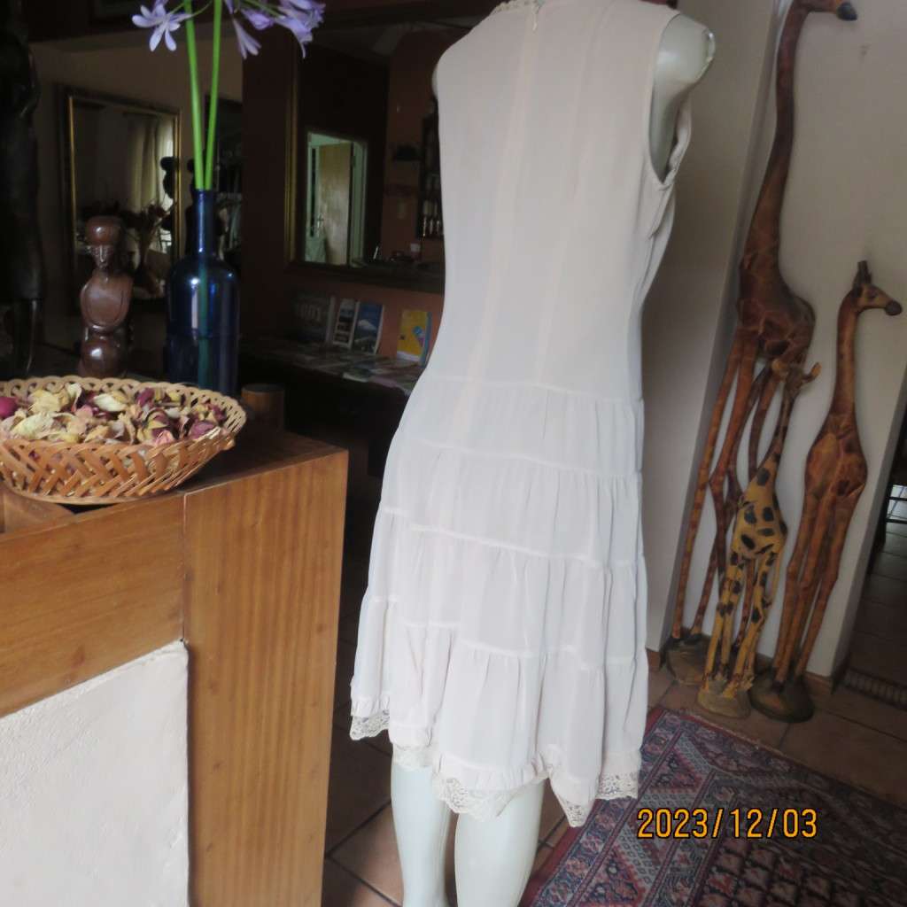 Smart ecru colour dropped waist dress with tiered bottom. Size 36. Square neckline. Fully lined.