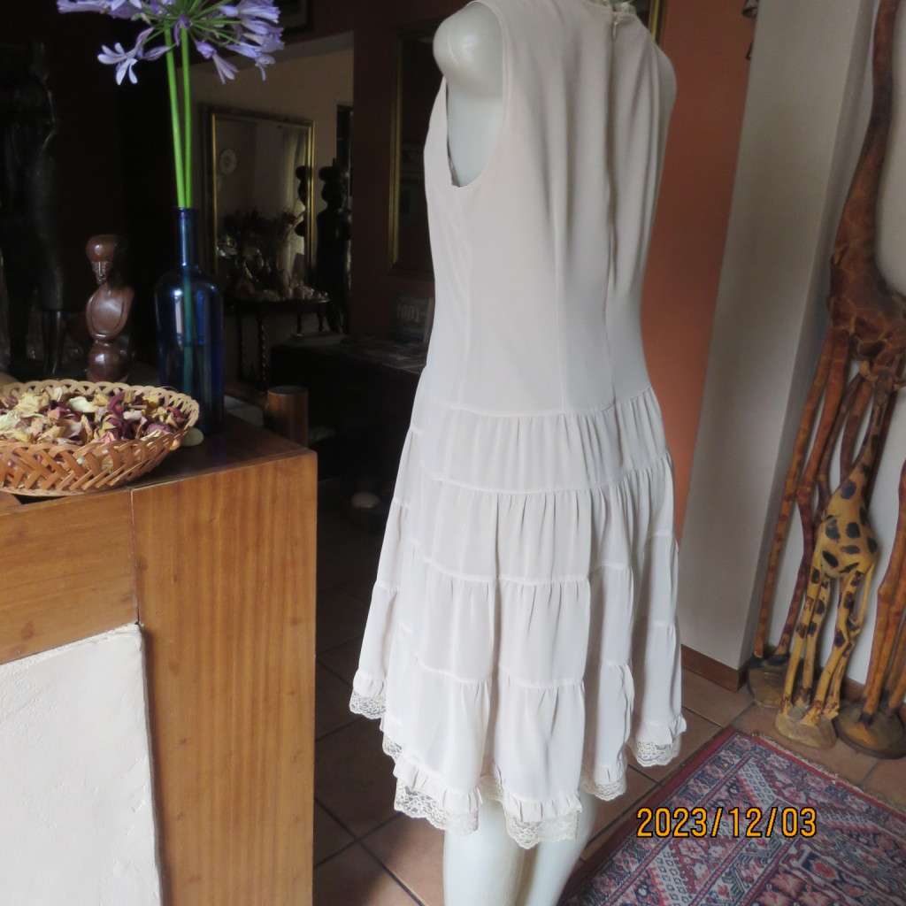 Smart ecru colour dropped waist dress with tiered bottom. Size 36. Square neckline. Fully lined.