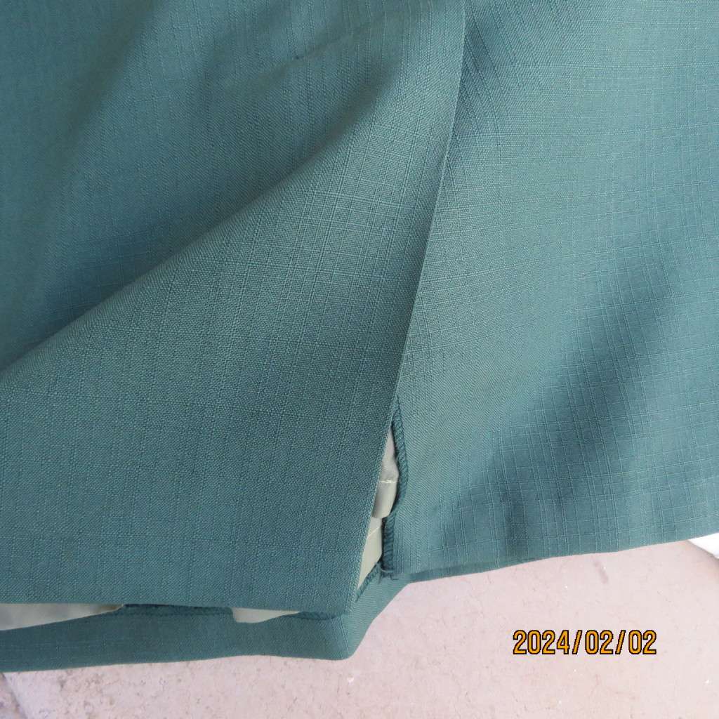 Smart dark green bottle green fully lined pencil size 36 skirt. With pleat and zip at back. As new.