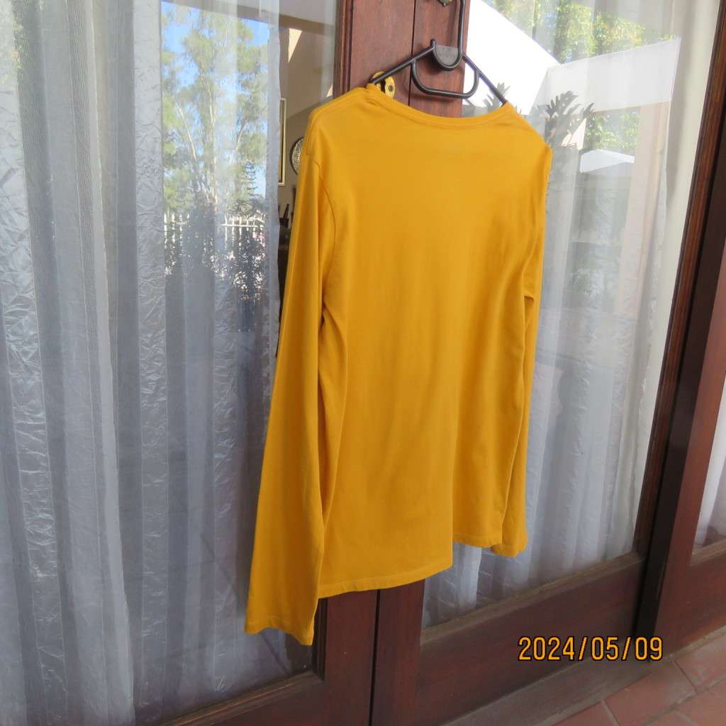 Unique mustard long sleeve 100% cotton top by (&US) size 15 to 16yr old boy. Stand out logo. New con