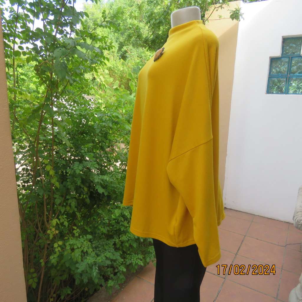 What not to like about this amber yellow warm polyknit top! Dolman sleeves. High cut neckline. 48/50