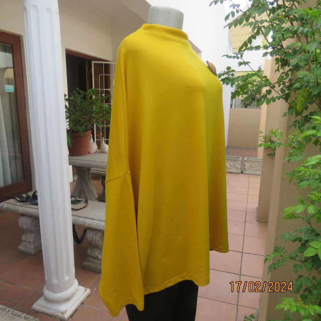 What not to like about this amber yellow warm polyknit top! Dolman sleeves. High cut neckline. 48/50