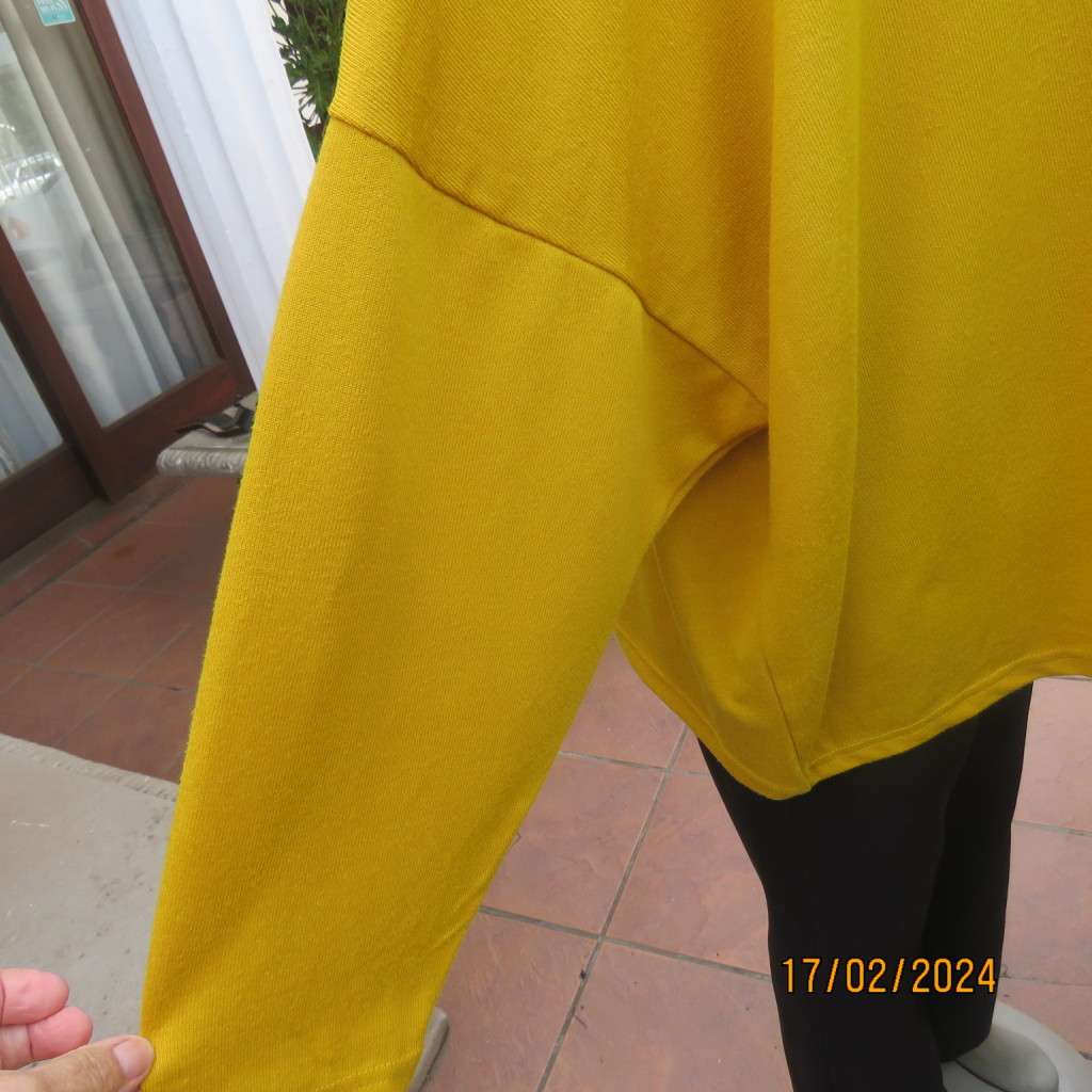 What not to like about this amber yellow warm polyknit top! Dolman sleeves. High cut neckline. 48/50