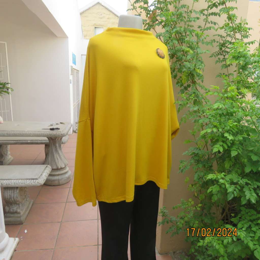 What not to like about this amber yellow warm polyknit top! Dolman sleeves. High cut neckline. 48/50