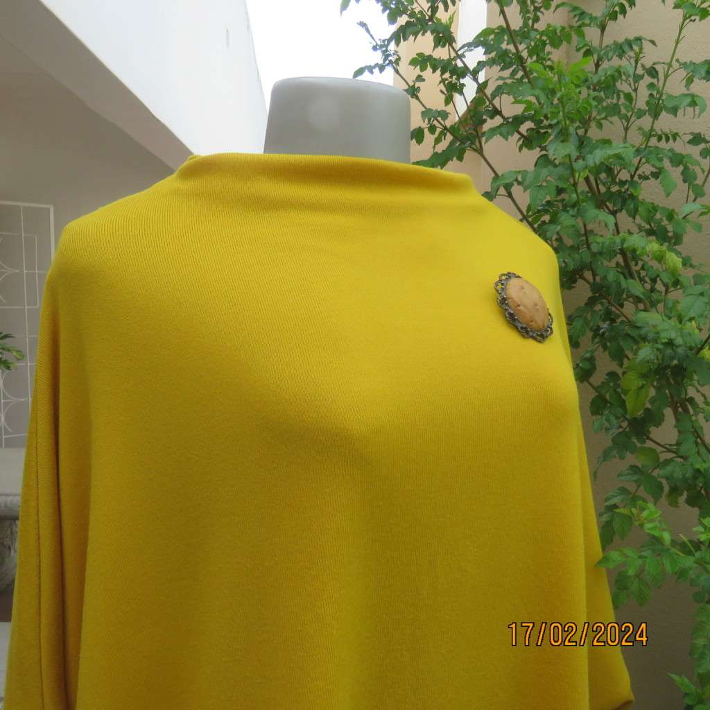 What not to like about this amber yellow warm polyknit top! Dolman sleeves. High cut neckline. 48/50