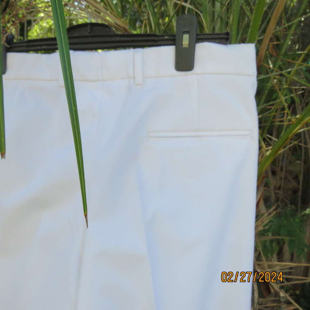 New white poly/viscose pants by FG Uniforms 2008. Size 34... 87cm/74RS. Pleats on front.Side pockets