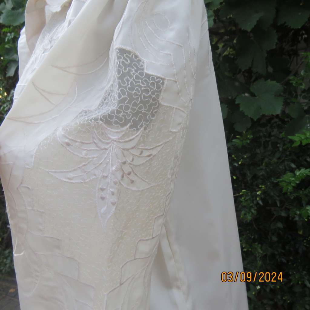 Just amazing rich cream long sleeve luxury embroidered blouse. Large size 40. Label cut. Brand new.