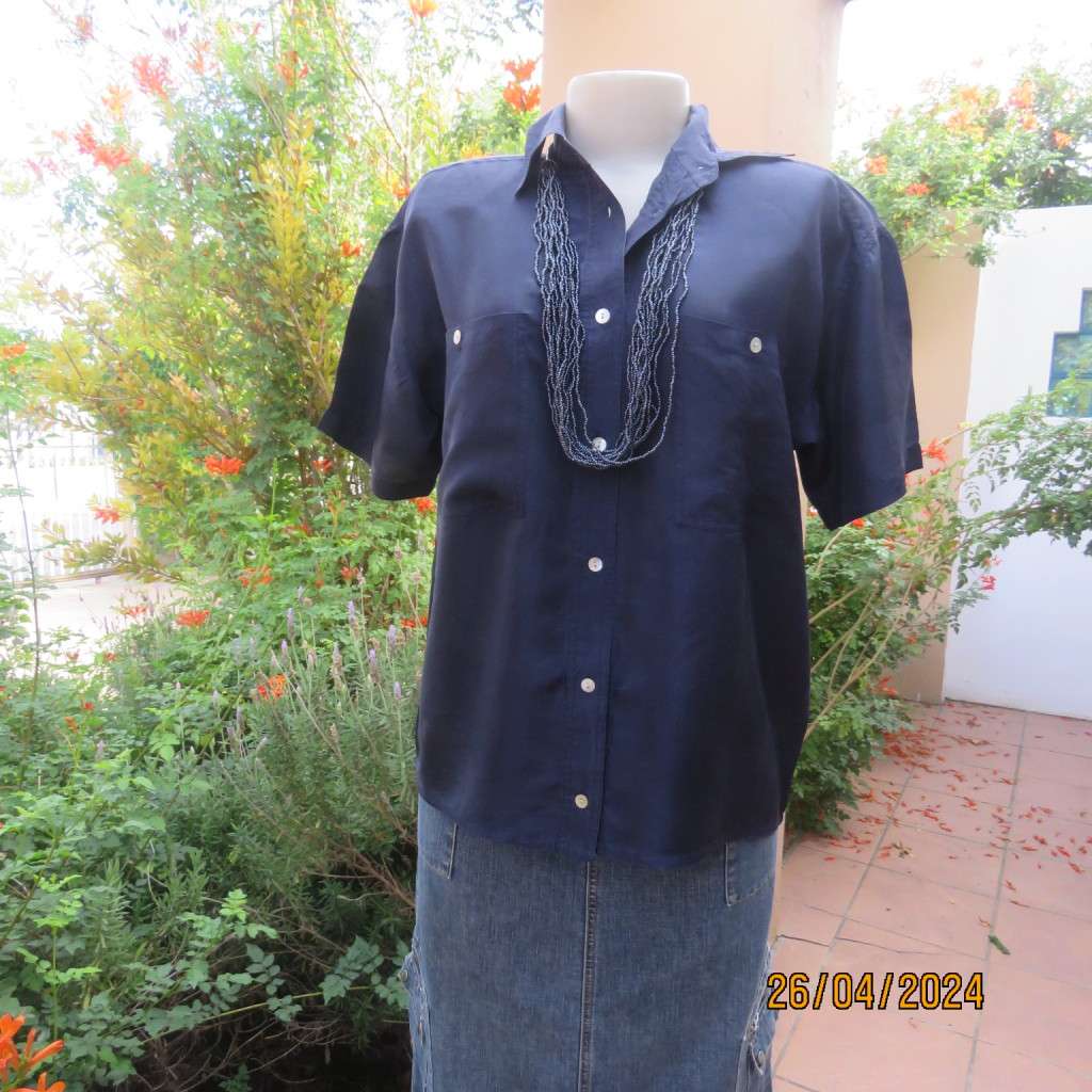 Smart 100% silk short sleeve navy button down top by NEWS size 36/38. Shirt collar.Very good cond.