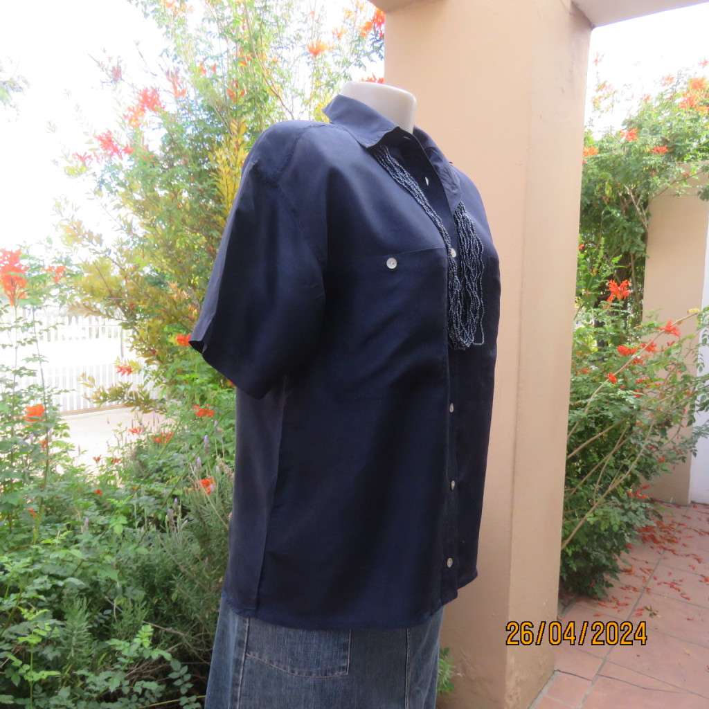 Smart 100% silk short sleeve navy button down top by NEWS size 36/38. Shirt collar.Very good cond.
