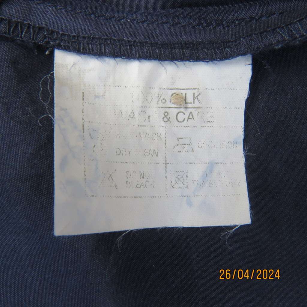 Smart 100% silk short sleeve navy button down top by NEWS size 36/38. Shirt collar.Very good cond.