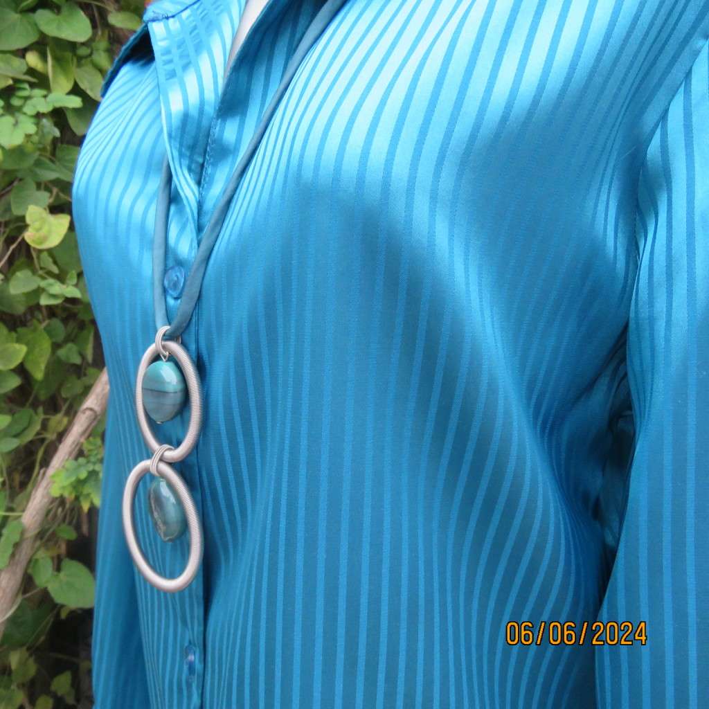 Luxury satin polyester jade long sleeve button down top/open collar. By TLC size 34. Brand new cond.
