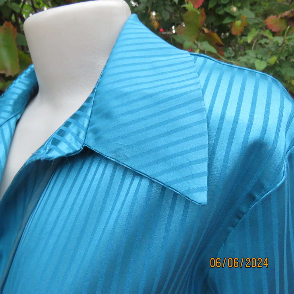Luxury satin polyester jade long sleeve button down top/open collar. By TLC size 34. Brand new cond.