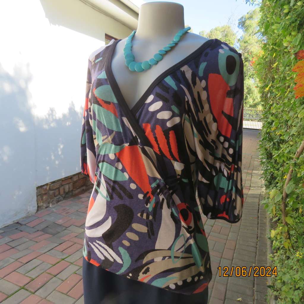 Geometric printed soft viscose stretch empire waist V neck cross over colourful top. WOOLWORTHS 38