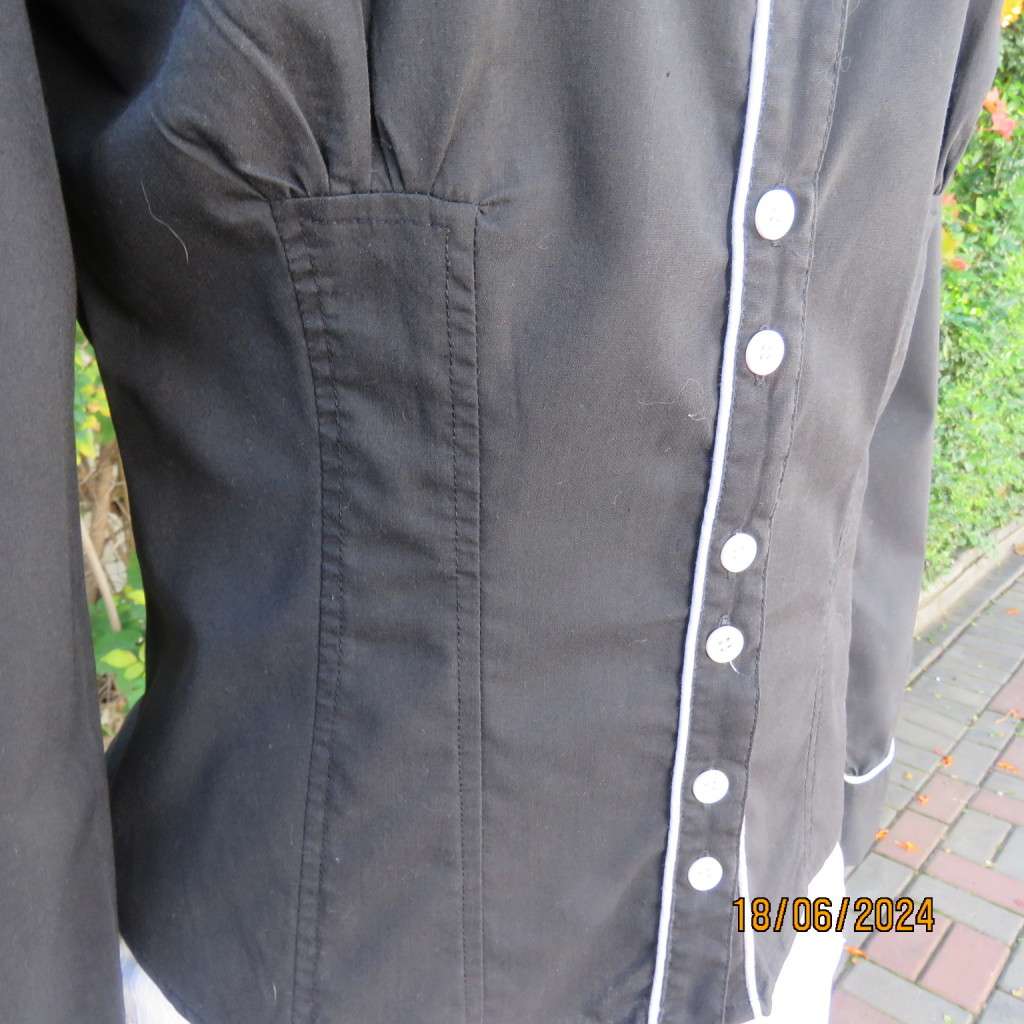 Charming long sleeves black tailored top. V button down front/collar. White edging/buttons.Size 36.