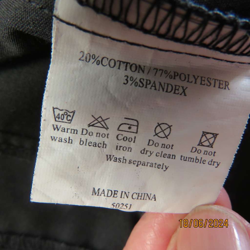 Charming long sleeves black tailored top. V button down front/collar. White edging/buttons.Size 36.