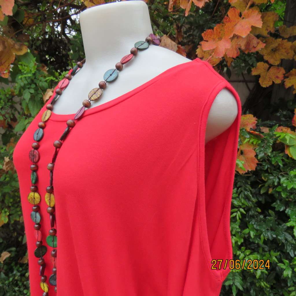 Fired up in red! Naked shoulder slip over viscose stretch top. Short cut-on sleeves.Size 42.As new.