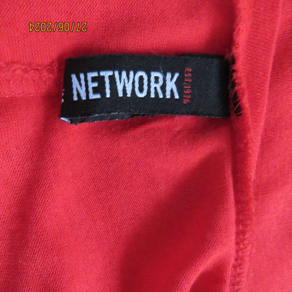 Fired up in red! Naked shoulder slip over viscose stretch top. Short cut-on sleeves.Size 42.As new.