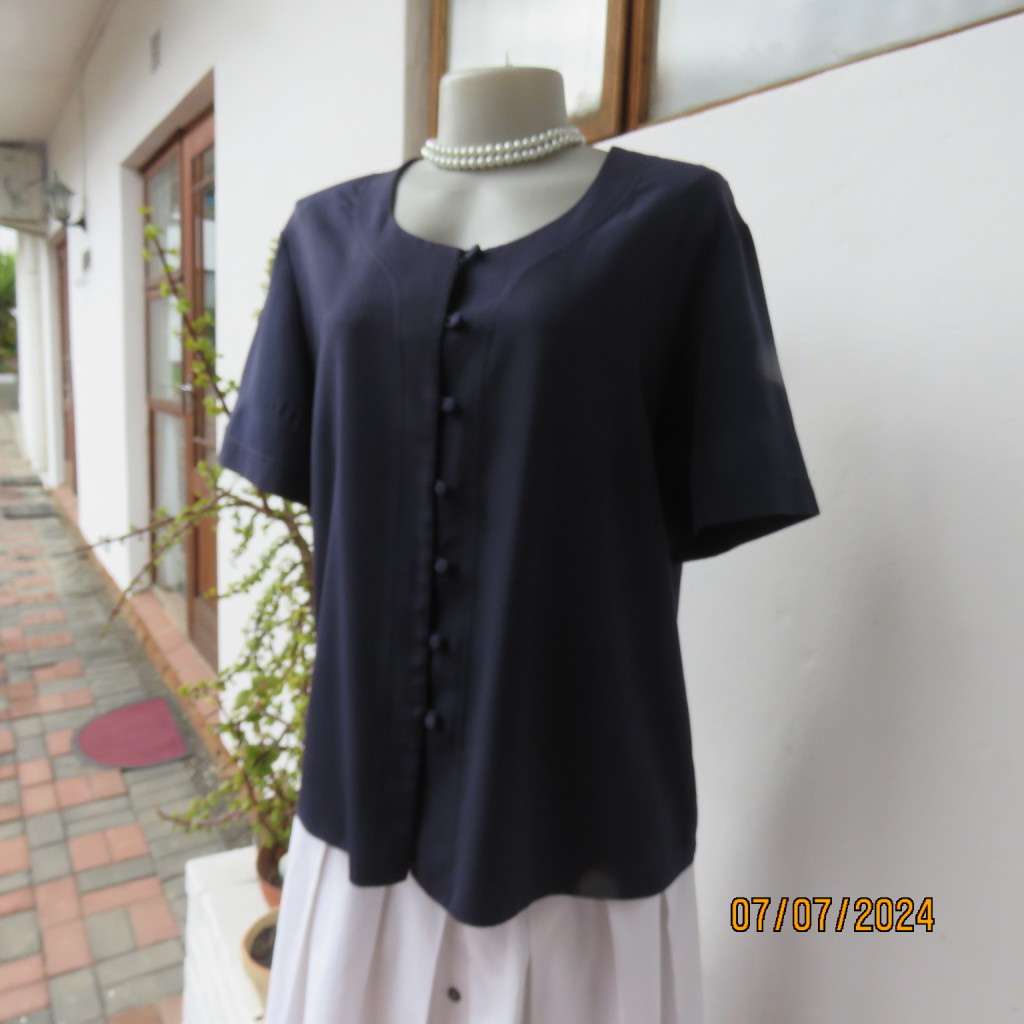 Smart, as new collarless navy silky polyester short sleeve top. Size 40.Close with loops and buttons