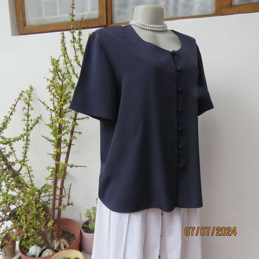 Smart, as new collarless navy silky polyester short sleeve top. Size 40.Close with loops and buttons