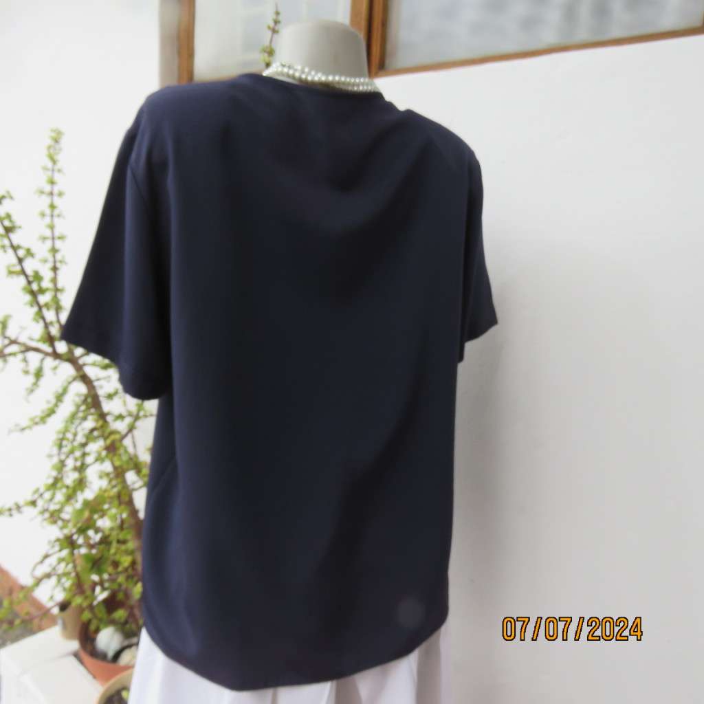 Smart, as new collarless navy silky polyester short sleeve top. Size 40.Close with loops and buttons