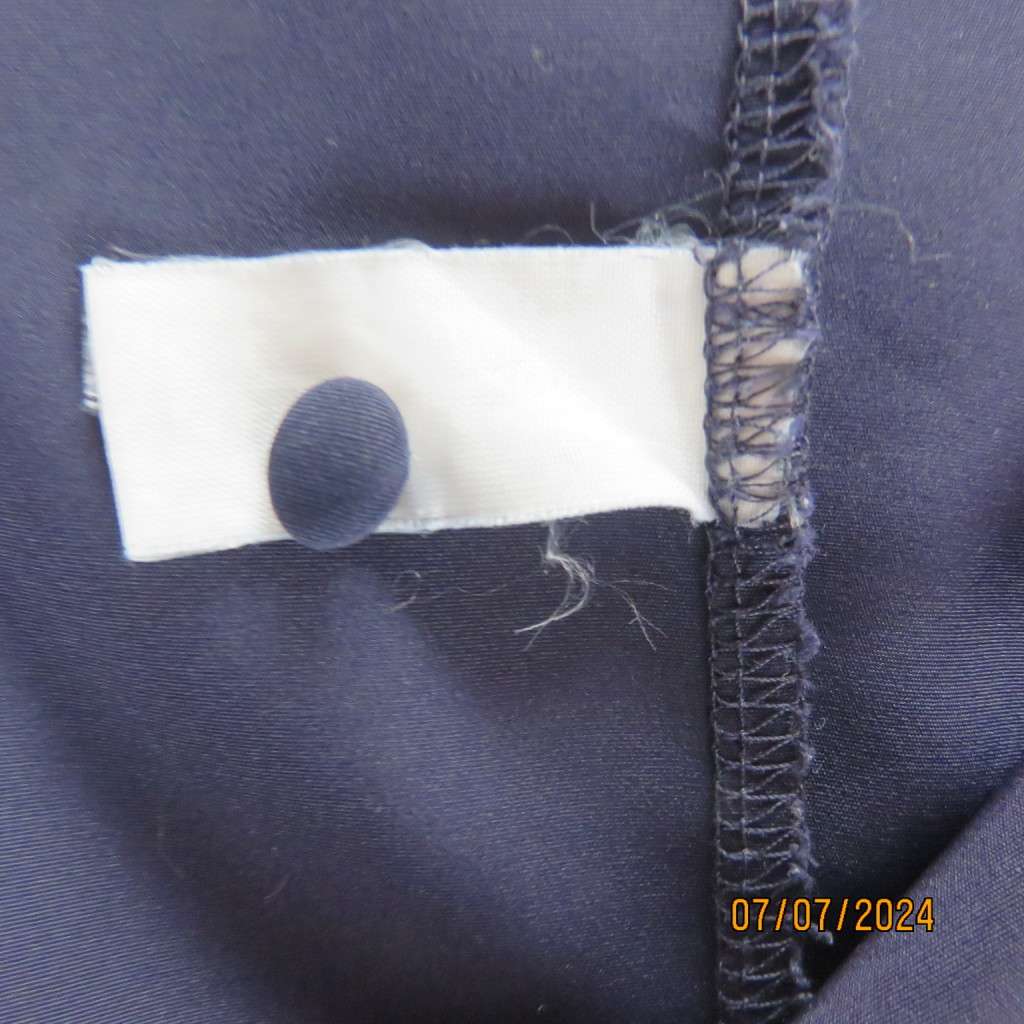 Smart, as new collarless navy silky polyester short sleeve top. Size 40.Close with loops and buttons