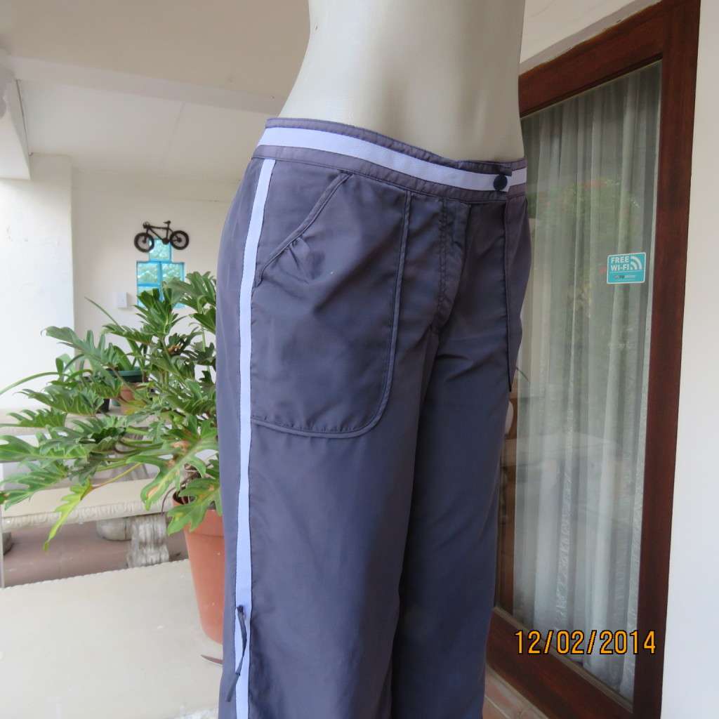 FUSION high quality grey polyester fitness pants. Blue bands at leg sides and front. Size 36.As new.