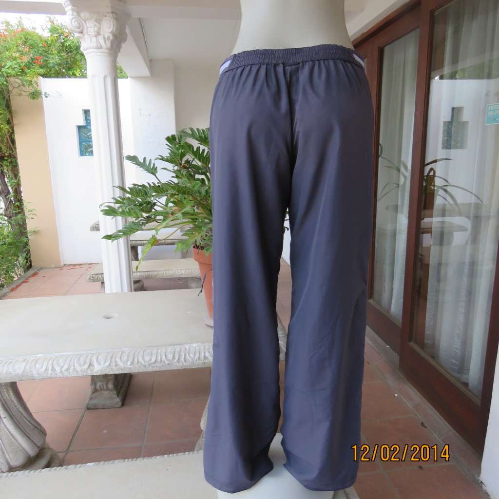 FUSION high quality grey polyester fitness pants. Blue bands at leg sides and front. Size 36.As new.