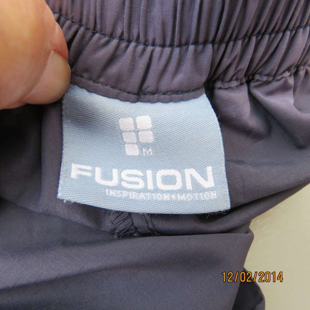 FUSION high quality grey polyester fitness pants. Blue bands at leg sides and front. Size 36.As new.