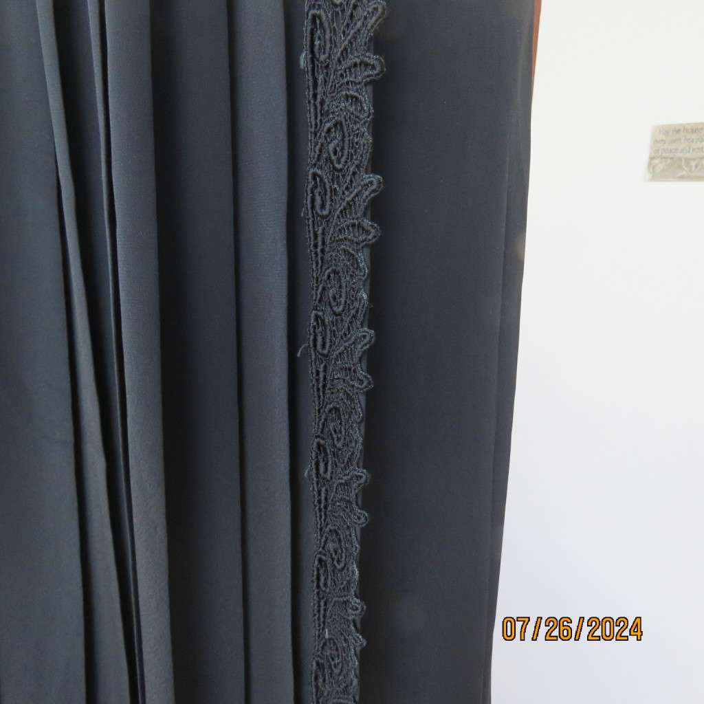 Very black silky,shiny knife pleated fold over ankle lenght skirt. Size 34/36 by TRUWORTHS. New cond