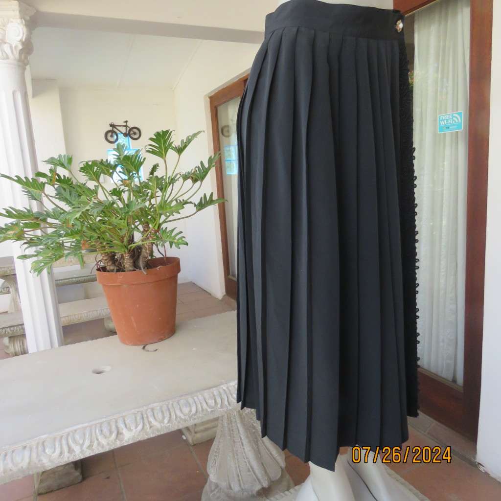 Very black silky,shiny knife pleated fold over ankle lenght skirt. Size 34/36 by TRUWORTHS. New cond