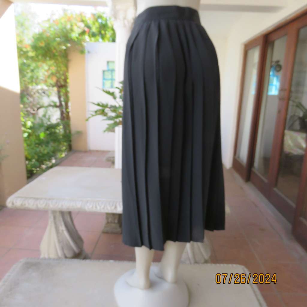 Very black silky,shiny knife pleated fold over ankle lenght skirt. Size 34/36 by TRUWORTHS. New cond
