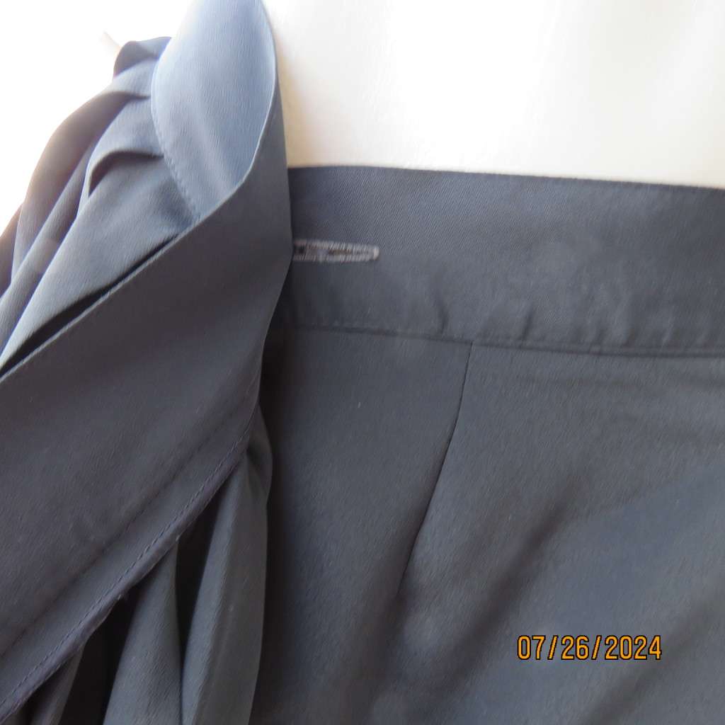 Very black silky,shiny knife pleated fold over ankle lenght skirt. Size 34/36 by TRUWORTHS. New cond