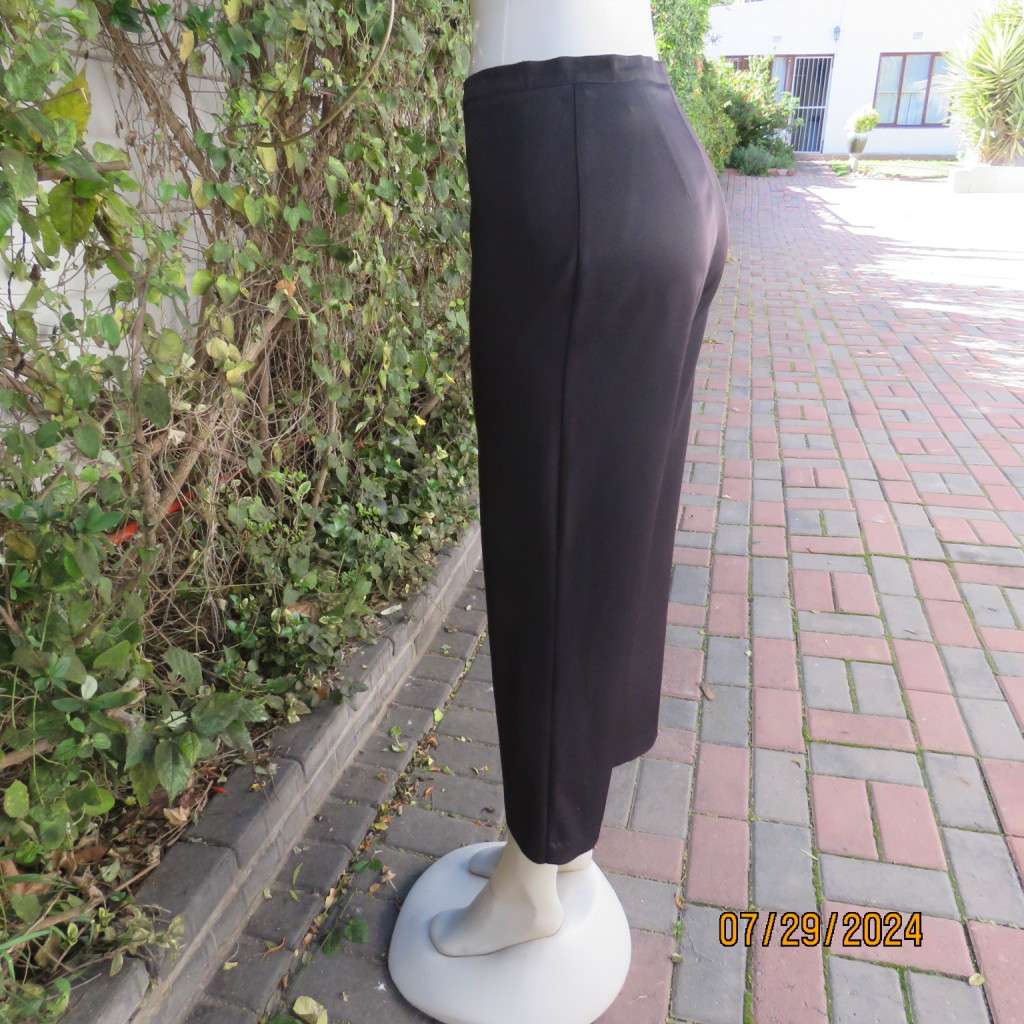 Black silky,shiny stretch polyester ankle length pants by MERIEN HALL size 35. Very good condition