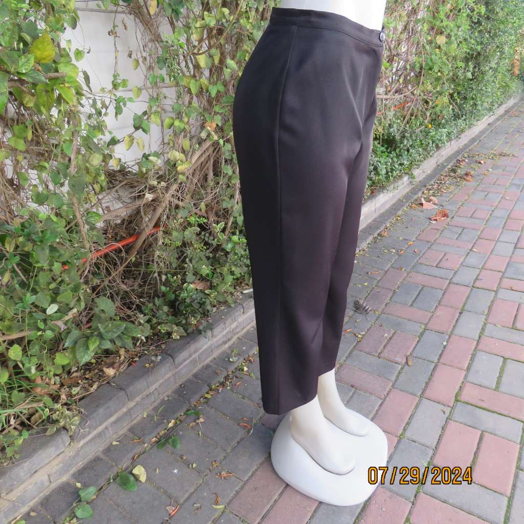 Black silky,shiny stretch polyester ankle length pants by MERIEN HALL size 35. Very good condition
