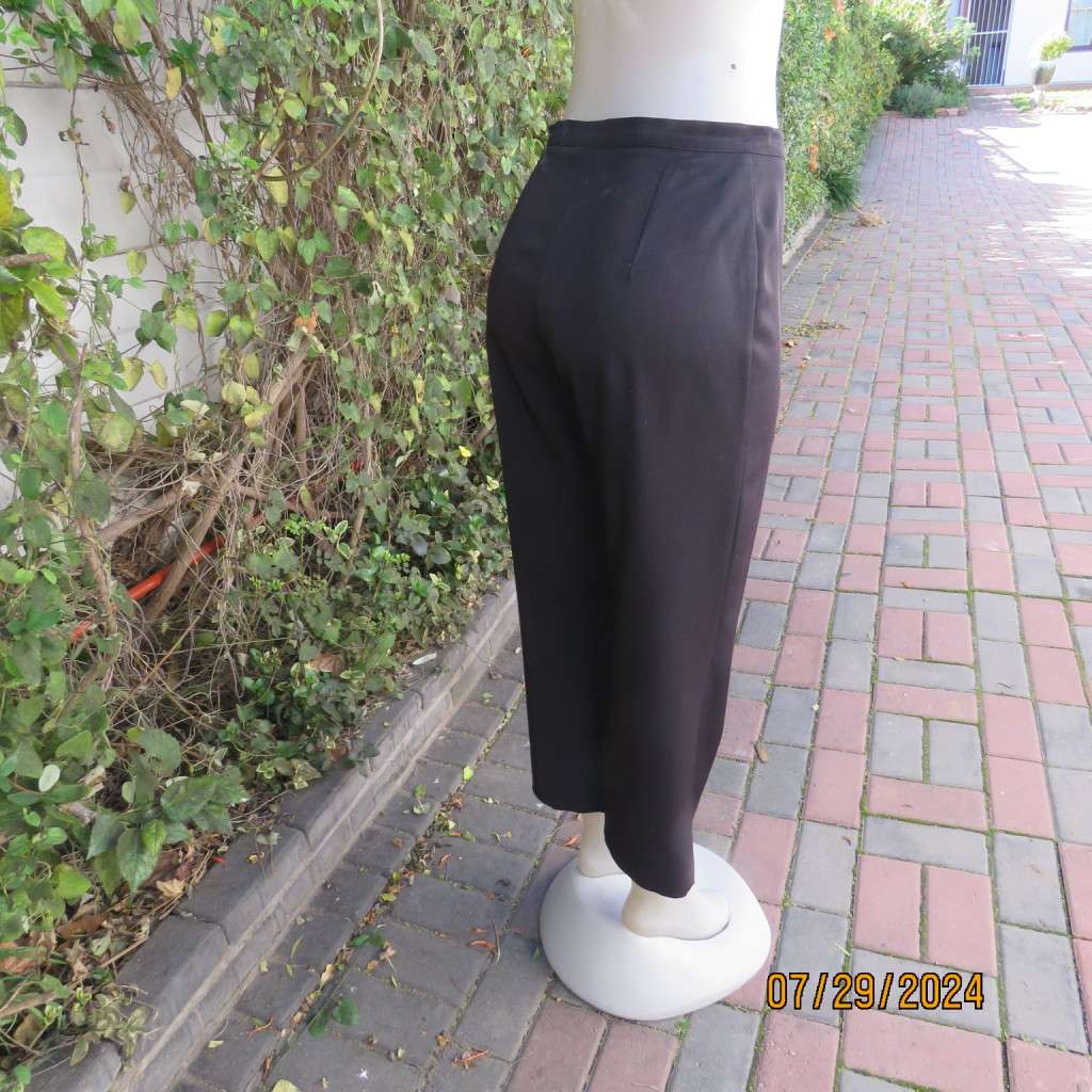 Black silky,shiny stretch polyester ankle length pants by MERIEN HALL size 35. Very good condition